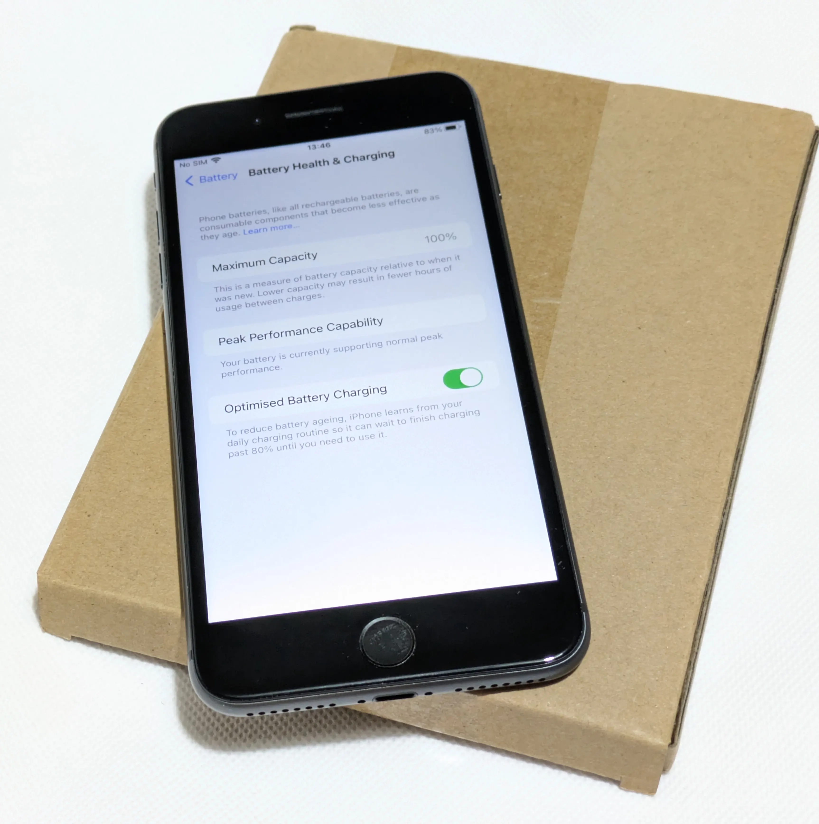 Used iPhone 8 Plus for sale in Liverpool, showcasing battery health settings with 100% maximum capacity, peak performance capability, and optimized battery charging enabled.